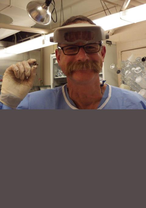 Kevin removing a bullet from a bear