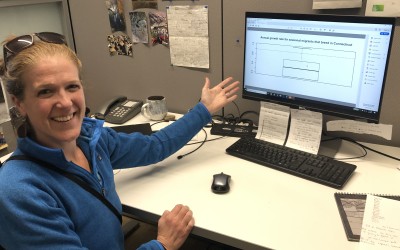 Brenda at her desk, showing math work on her computer screen