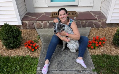 Jenny on the stoop with her dog Zoey