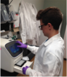 Cornell DVM student, Sean Stapleton processing eDNA samples in the lab.