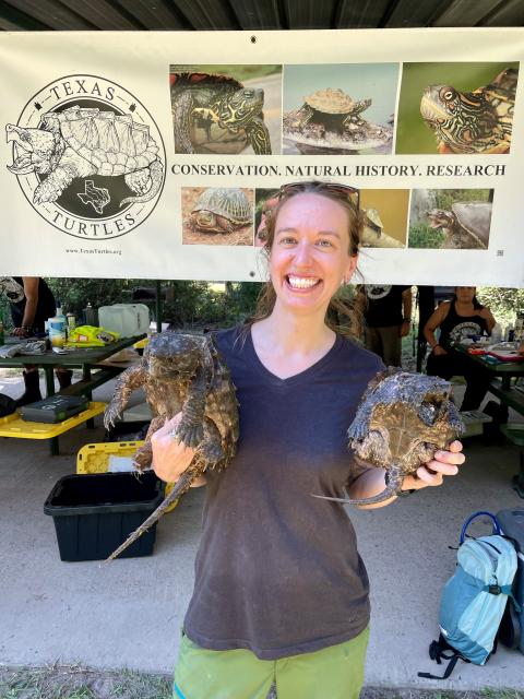 Melissa holding two ASTs waiting for their turn to be examined during the survey.