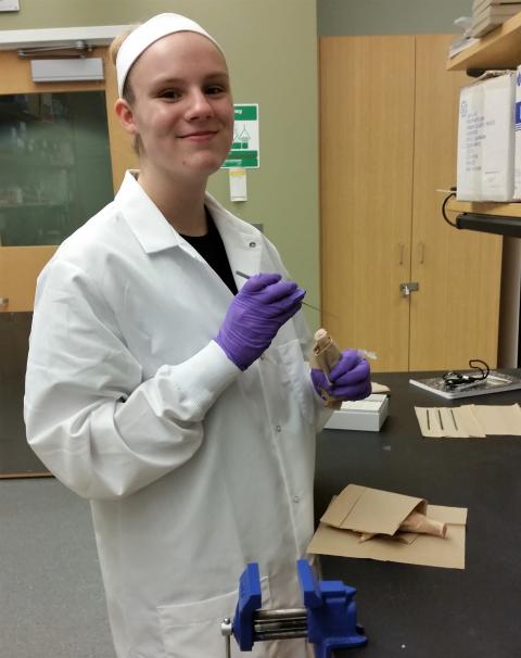 CWHL/New Visions student extracting bone marrow form turkey legs