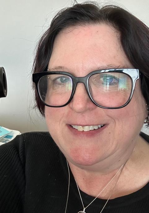 Beth behind the microscope