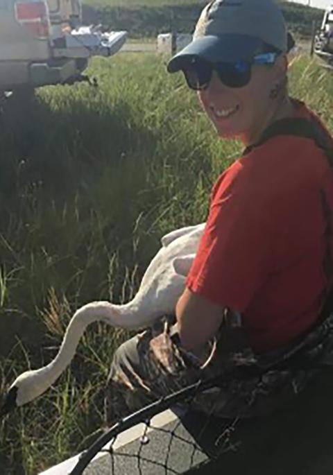Jen in the field with a swan