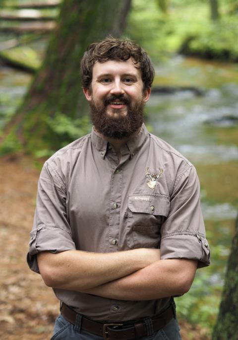 Man standing in woods
