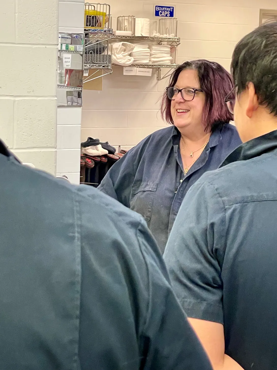 Dr. Buckles discussing tissue harvesting techniques with DVM students at a CWD wet lab at the AHDC