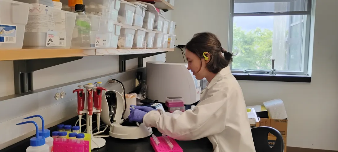woman processing sample in a lab