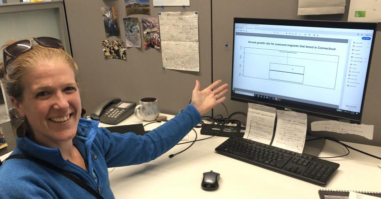 Brenda at her desk, showing math work on her computer screen