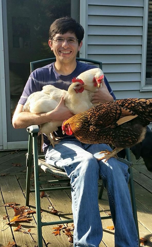 John hanging out with some of his favorite ladies - chickens!